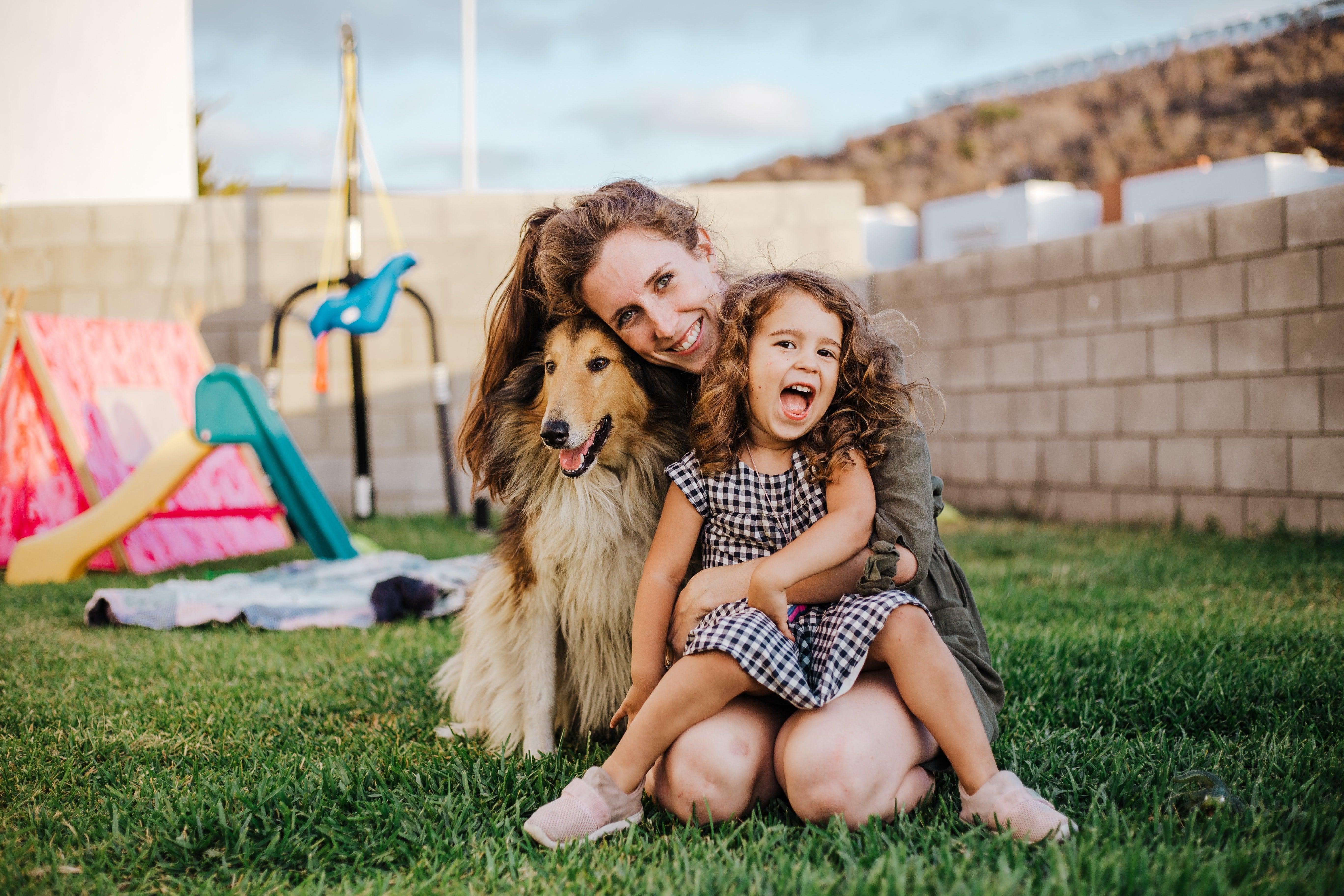 A family discussing and researching different dog breeds to find the best fit for their lifestyle and family dynamic